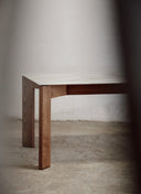 180cm x 90cm Palmares Stone Table, a custom furniture dining table that seats 6 people comfortably in a modern interior.