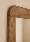 Close up of the rounded form and premium finish on the Juntowd Aura bespoke sculptural mirror