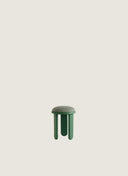 Juntowd Trio Stool: a bespoke furniture piece featuring an upholstered seat and a handcrafted chestnut three-legged frame.