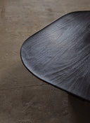 Bespoke Nero Coffee Table handcrafted from Portuguese Walnut, showcasing a grounded base and rounded top.