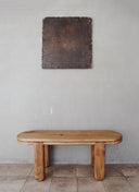 Custom furniture Travessa Bench used as a compact entryway seat, featuring a quiet and distinctive architectural design.